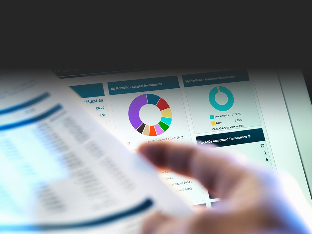 A man looking at his investment portfolio