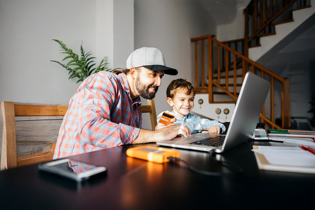 Father and son on a laptop